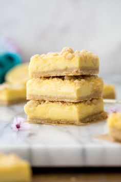 three lemon bars stacked on top of each other