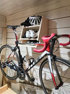 a bicycle parked next to a shelf with shoes on it