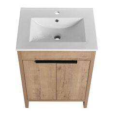 a white sink sitting on top of a wooden cabinet