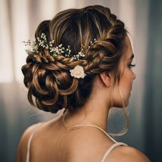 Embrace elegance with this intricate braided updo, featuring multiple small braids woven into a textured bun. Adorned with decorative flowers and soft, loose tendrils framing the face, this romantic hairstyle is set against a classic ballroom backdrop. #BraidedUpdo #TexturedBun #DecorativeFlowers #RomanticHairstyle #ElegantUpdo #WeddingHair #ClassicBeauty #IntricateBraids Bridal Updo With Braid, Gala Hairstyles, Intricate Braided Updo, Updo With Braid, Textured Bun, Wedding Bun, Bridal Bun, Romantic Hairstyles, Small Braids