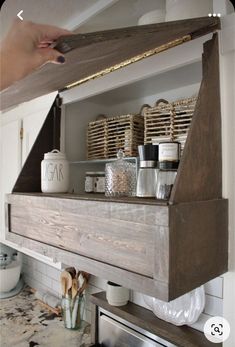 a kitchen shelf with jars and containers on it