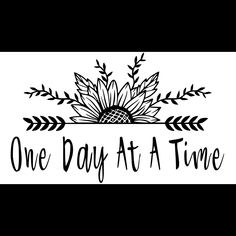 one day at a time sign with flowers and leaves on the bottom, in black and white