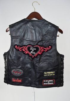 Vtg Black Leather Motorcycle Vest w Patches // Biker Babe, Love to Ride, Lady Rider // Badass Rock S Fitted Black Rocker Vest, Black Fitted Rocker Vest, Biker Style Sleeveless Vest For Festivals, Biker Sleeveless Vest For Festivals, Edgy Black Vest For Biker Events, Black Fitted Moto Vest, Fitted Biker Vest For Festivals, Biker Style Fitted Vest For Festivals, Black Fitted Biker Vest