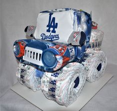 a cake made to look like a toy truck with diapers on the front and sides