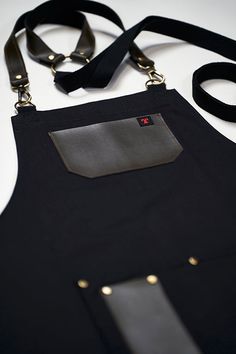 the apron is black with gold trimmings