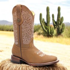 Step into Western style with these handcrafted women's cowgirl boots, made from premium tan leather and featuring a chic square toe design. Perfect for everything from a night out to a day on the ranch, these boots combine comfort and durability with authentic cowboy charm. Their timeless, rugged look makes them a versatile addition to any wardrobe, offering a touch of the wild west to any outfit. 11" Leather upper 1.5" Block heel Leather outsole  Leather lining  Pull-on straps Goodyear welt construction Made In Mexico  *Item runs big, recommended to size down 1/2 a size. Square Toe Leather Boots, Tan Square, Womens Cowgirl Boots, Cowgirl Cowboy, The Wild West, Rugged Look, Style Boots, Goodyear Welt, The Ranch