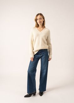 Elevate your winter wardrobe with the GAVARNIE V-Neck Sweater, a must-have basic reimagined for ultimate coziness. Crafted in our Norman Ateliers, this sweater features a plush pearled knit that enhances its soft, luxurious feel. Made from a mohair blend, it’s delightfully warm and comfortable. The cable-knit details add a touch of classic charm, while the ribbed V-neck ensures a polished finish. Perfect for those chilly days when you want both style and comfort. - Sweater - V- neck - Ribbed nec Breton Stripe Shirt, Fall Stripes, Fall Must Haves, Elegant Scarves, Spring Shirts, Swimwear Sale, Knit Jacket, Winter White, Sweater Coats