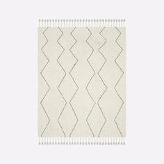 a white rug with wavy lines on it