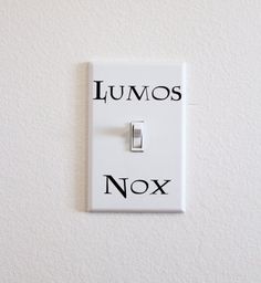 a light switch with the words lumos and nox on it