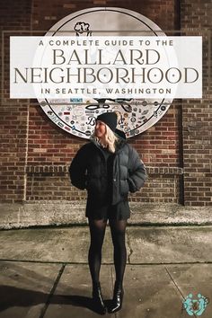 a woman standing in front of a sign that says, a complete guide to the ballard neighborhood