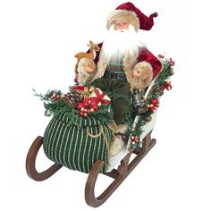 a santa clause sitting on top of a sleigh filled with christmas decorations and gifts