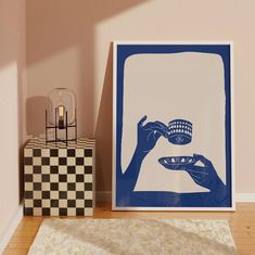 there is a blue and white poster next to a black and white checkered rug