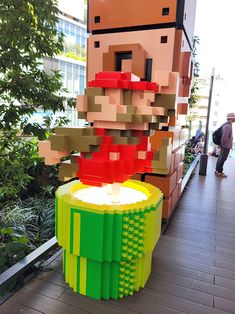 a sculpture made out of legos is on display