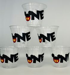 six plastic cups with mickey mouse designs on them