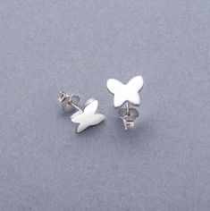 925 Silver Butterfly Stud Earrings, Handmade Animal Jewelry, Minimal Butterfly Earrings, Dainty Earring Gift for Her, Boho Chic Jewelry * Materials: Sterling Silver * Color: Silver * Earring Style Cut: Butterfly * Size: 8X9mm * Quantity: One pair * Made to Order These 925 sterling silver minimalist earring perfect for daily wear. Their simple and stylish design makes the mealy to pair with an outfit. Made from high-quality silver, they are durable and comfortable, perfect for everyday use or as Hypoallergenic Sterling Silver Butterfly Earrings, Butterfly Shaped Sterling Silver Earrings, Silver Sterling Butterfly Earrings, Silver Sterling Silver Butterfly Earrings, Minimalist Sterling Silver Butterfly Earrings, Minimal Butterfly, Jewelry Minimal, Minimalist Earring, Jewelry Materials