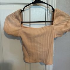 Never Worn Casual Orange Ribbed Top, Fitted Orange Ribbed Top, Trendy Apricot Tops For Spring, Chic Orange Puff Sleeve Tops, Spring Apricot Trendy Tops, Trendy Fitted Peach Crop Top, Orange Ribbed Tops For Spring, Trendy Fitted Apricot Top, Casual Orange Crop Top For Day Out