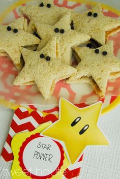 star power cookies are on a plate next to a red and white napkin