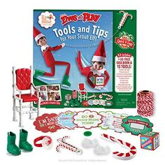 the elf on the shelf is doing tricks with his elves and candy canes in front of him