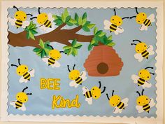 a bulletin board with bees and a beehive