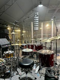 a drum set up in an empty room