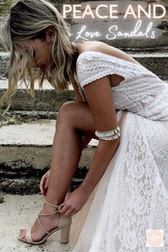 a woman in white dress sitting on steps with her hand on her knee and the words, peace and love sandals