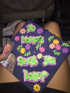 a decorated graduation cap with flowers on it