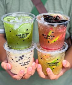 three cups filled with different types of drinks