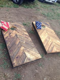 two wooden boards laying on the ground next to each other