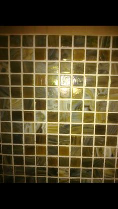 an image of a tiled wall in the bathroom