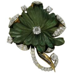 This is a spectacular flower motif brooch in Turquoise with a total of 3.15 Carat of antique Diamonds set in Platinum atop Gold. The central diamond has been certified by EGL as .85 Carat, and is G color (very white) and I2 clarity. The diamonds are set in Platinum atop 14 Karat Gold. The flower is a masterpiece of jewelry design. It dates to the Belle Epoque Victorian period, circa 1860 - 1900. The vivid green of the flower with the brilliant white antique diamonds is magnificent. DIAMONDS One Vintage Green Diamond Brooches, Luxury Flower Shaped Brooch Jewelry, Luxury Green Brooch For Anniversary, Luxury Green Brooches For Anniversary, Luxury Green Brooches For Wedding, Brooch Flower, Diamond Bows, Bow Brooch, Flower Motif