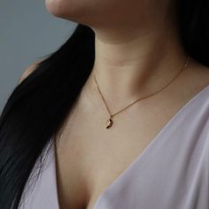 Introducing our Marlow Necklace, a testament to timeless elegance and refined minimalism. The marquise shape gracefully frames a CZ stone, adding a touch of sparkle and radiance. Its minimalistic style makes it perfect for any occasion. -stainless steel, gold plated -15.5" with 2" extender Elegant Charm Necklace With Delicate Stainless Steel Chain, Minimalist Gold Plated Oval Pendant Charm Necklace, Elegant Stainless Steel Charm Necklace With Delicate Chain, Elegant Crescent Charm Necklace With Delicate Chain, Elegant 14k Gold Moon Charm Necklace, Elegant Everyday Crescent Charm Necklace, Elegant Oval Pendant Stainless Steel Jewelry, Elegant Stainless Steel Jewelry With Delicate Chain, Minimalist Silver Gold-plated Charm Necklaces