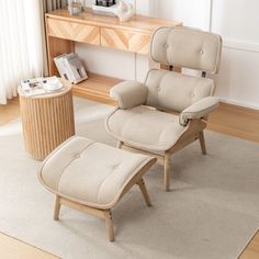 a chair and ottoman in a living room with a wooden table on the other side