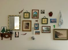 there are many pictures on the wall with frames