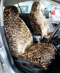 the interior of a car with leopard print seat covers on it's front and rear seats