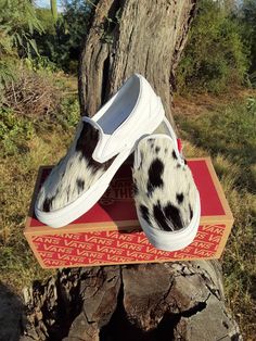 Women's 8.0, men's 6.5, white slip-on Vans.  I customized this pair with gorgeous black and white hair-on hide.  Very silky.  Stitched with black heavy duty thread, all done by hand.  Please ask any questions you may have about these shoes or a custom request.  Thanks for looking! Western Wedding Shoes, Customised Vans, White Slip On Vans, Vans Slip On, White Slip, Western Wedding, White Hair, Slip Ons, Hand Stitched