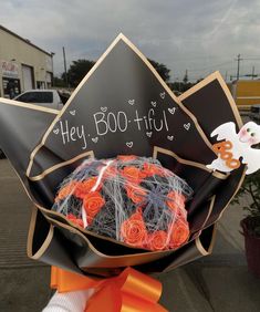 someone is holding up a fake hat that says hey boo - fil