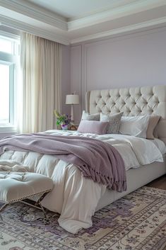 a bedroom with a large bed and purple walls