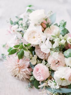 a bouquet of flowers is laying on the table