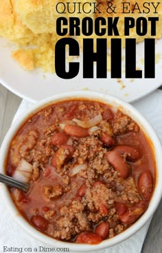 a white bowl filled with chili next to cornbread