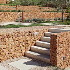 a stone wall with steps leading up to it