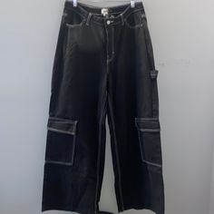 Nwt, In Great Condition. Eu 44. High Rise, Belt Loops, Pockets And Wide Leg. (Looks Lighter Due To Overhead Lighting) High Waist Pants With Contrast Stitching For Streetwear, Black Cargo Jeans With Pockets For Spring, High-waist Pants With Contrast Stitching For Streetwear, Black Jeans With Side Pockets For Spring, Black Cargo Jeans With Side Pockets For Spring, Casual Wide Leg Bottoms With Contrast Stitching, High Rise Utility Pants With Contrast Stitching, High Rise Bottoms With Contrast Stitching For Streetwear, Trendy Wide Leg Cargo Pants With Contrast Stitching