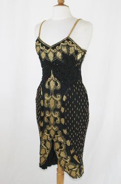 a black and gold dress on a mannequin