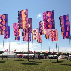 many colorful flags blowing in the wind