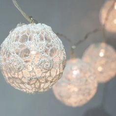 string lights with white balls hanging from them