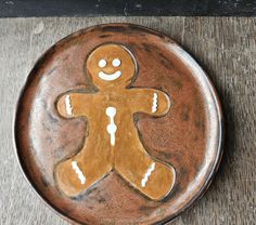 a ceramic plate with a ginger on it