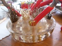 several pairs of red handled scissors in a clear container