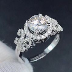 a white gold engagement ring with diamonds on it