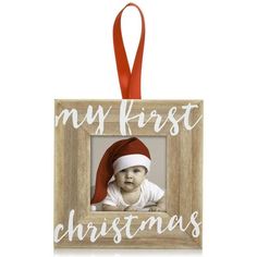 a christmas ornament with a baby wearing a santa hat