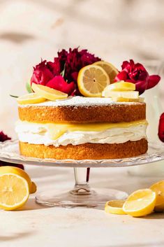 there is a cake with lemons and roses on it