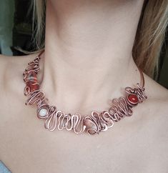 This wrap necklace made of copper wire, hammered, oxidized and highly polished to highlight the details of the wire work and natural Agate, an amazing gemstone with mystic shining. Agate is a stone of health and passion, and brings the courage to face unpleasant tasks and to rectify unjust situations. As shown in the pictures, this necklace has open ends with two ornaments on each side, which makes it perfect to be adjusted for your neck. Handmade wire wrapped necklace made from pure copper wire whit a big colorful agate real natural stone and copper beads.  Oxidized necklace  look like piece of old jewelry. Necklace is adjustable. All jewelry  I'm  making of natural stones. The material used: -Pure copper wire -Natural agate stone Measurements:- - The length of the  necklace is 49 cm ( 19 Spiritual Copper Wire Necklace With Natural Stones, Mystical Silver-color Copper Necklace, Nature-inspired Copper Wire Necklace With Natural Stones, Amber Agate Wire Wrapped Necklace, Adjustable Wire-wrapped Agate Beaded Necklace, Art Nouveau Necklaces, Oxidized Necklace, Wrap Necklace, Wrapped Necklace